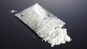 <p>Stick image of plastic bag containing drugs</p>
