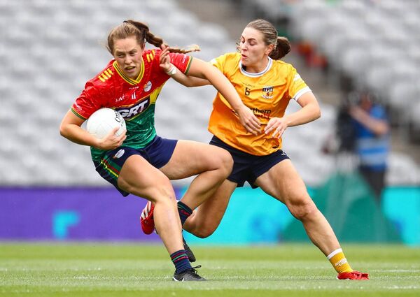 Carlow's Clíodhna Ní Shé under pressure from Anrim's Dúana Coleman.