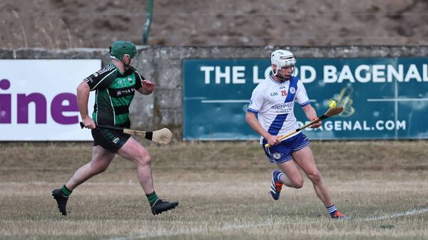 Liam Cummins (Bagenalstown Gaels) tries to close down Carlow Town's James Ingram. Liam Cummins (Bagenalstown Gaels) tries to close down Carlow Town's James Ingram.