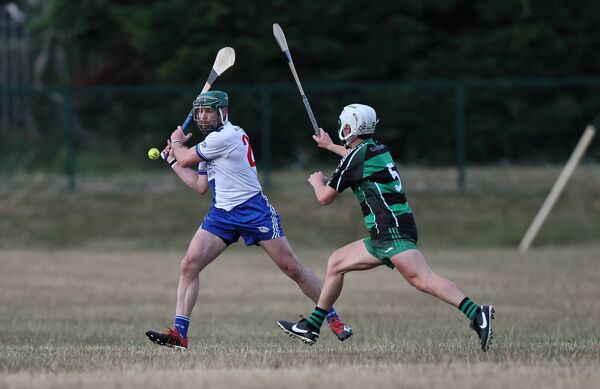 Shane Coady from Bagenalstown Gaels tries to block Ruairi Dunbar's shot. Shane Coady from Bagenalstown Gaels tries to block Ruairi Dunbar's shot.