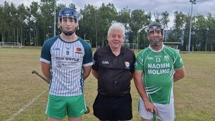 <p>Burren Rangers captain, Dan Kearney, referee, Damien Brady, and St Mullins captain, Michael Fenlon.</p>