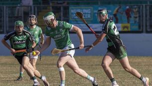 <p>Paul Doyle carries the ball out of defence for St Mullins</p> <p>Paul Doyle carries the ball out of defence for St Mullins</p>