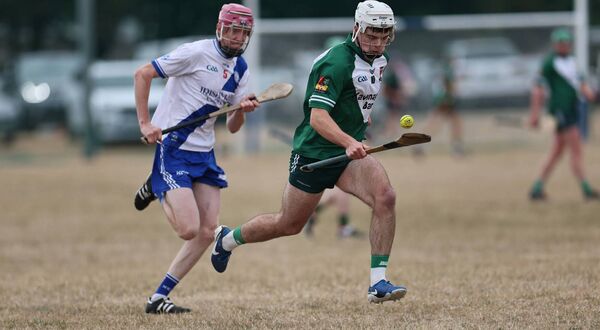 Carlow Town's Matthew English Hayden chases down Cathal Healy of Burren Rangers. Carlow Town's Matthew English Hayden chases down Cathal Healy of Burren Rangers.