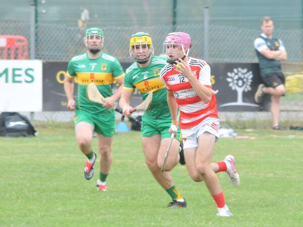 Shane Donoghue (Cappagh) breaks away from Daire McNickle. Shane Donoghue (Cappagh) breaks away from Daire McNickle.