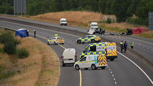 Garda charged with soliciting murder of woman and three children Garda charged with soliciting murder of woman and three children