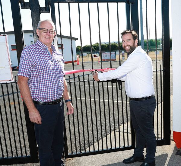 Darragh Ware with Cllr Fintan Phelan as he cuts the ribbon to open the refurbished Walking Track. Darragh Ware with Cllr Fintan Phelan as he cuts the ribbon to open the refurbished Walking Track.