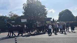 <p>The funeral procession of Jeremy O'Brien makes its way to St Mary's Cemetery. </p>