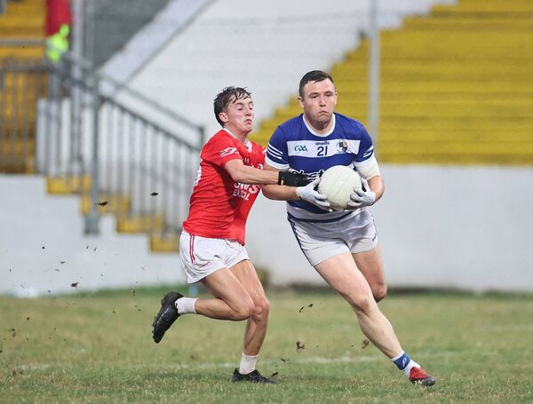 Tinryland's John Murphy bursts past the tackle of Éire Óg's Dermot Lawler. Tinryland's John Murphy bursts past the tackle of Éire Óg's Dermot Lawler.