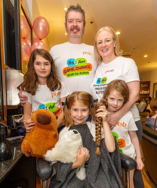 Zoe proudly holds the ponytail that will be donated to charity. She's pictured with her parents Clare and Shane and sisters, Lily and Isabella Zoe proudly holds the ponytail that will be donated to charity. She's pictured with her parents Clare and Shane and sisters, Lily and Isabella