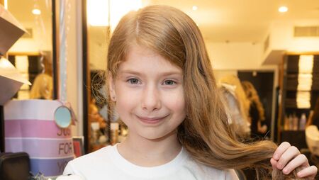 Autism diagnosis inspires Zoe to donate her long locks to charity while raising almost €600