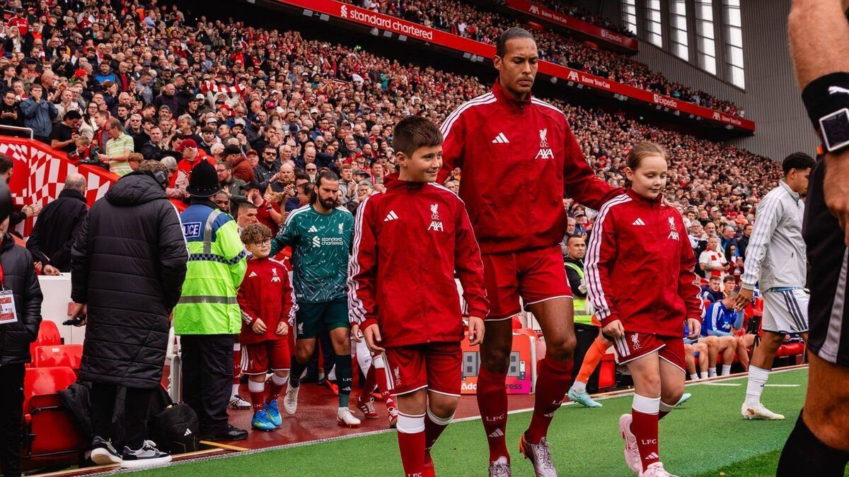 Liverpool fan Max leads team onto pitch at Anfield