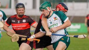 <p>Burren Rangers Daniel Bolger (Burren Rangers) is closed by Mount Leinster Rangers duo Jack Ryan and Dan Ryan </p>