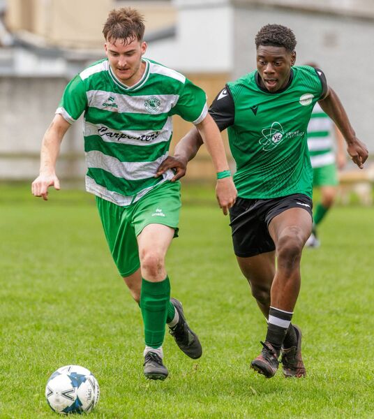 New Oak’s matchwinner Cian Cleary tries to get away from Hanover Harps' Gael O’Rock. Photo: Michael O'Rourke New Oak’s matchwinner Cian Cleary tries to get away from Hanover Harps' Gael O’Rock. Photo: Michael O'Rourke