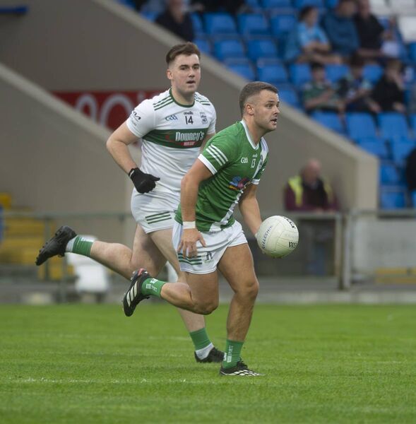 Killeshin's Evan Lowry breaks away from Portlaoise's Damon Larkin.