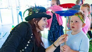 <p>Clara-Belle from the Wobbly Circus helps Pauric Delaney spin and balance a plate </p>