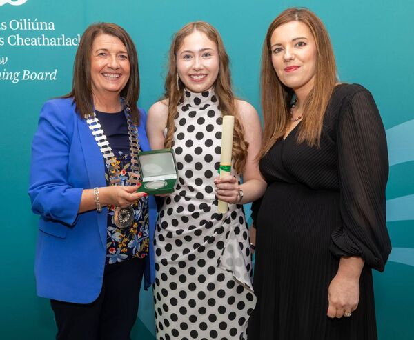 Faith Nic Aogain from Gaelcholaiste Cheatharlach receives her award from cllr Andrea Dalton, chairperson KCETB, at the awards ceremony in the Woodford Dolmen Hotel, Carlow, with Principal Orlagh Ni Fhaolain Photo: © Michael O'Rourke Photography 2026 Faith Nic Aogain from Gaelcholaiste Cheatharlach receives her award from cllr Andrea Dalton, chairperson KCETB, at the awards ceremony in the Woodford Dolmen Hotel, Carlow, with Principal Orlagh Ni Fhaolain Photo: © Michael O'Rourke Photography 2026