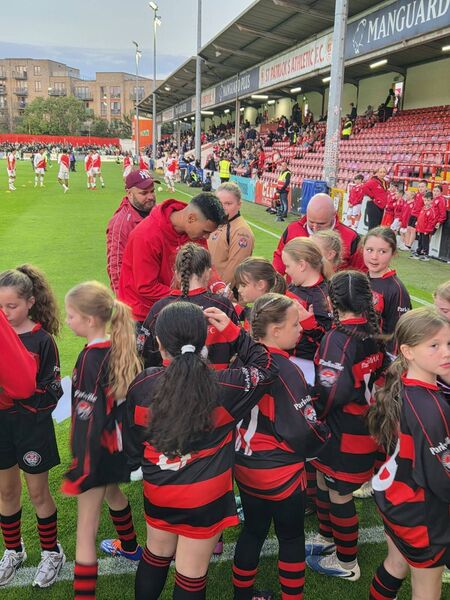 More autographs pitchside as the Saints warm up behind. More autographs pitchside as the Saints warm up behind.