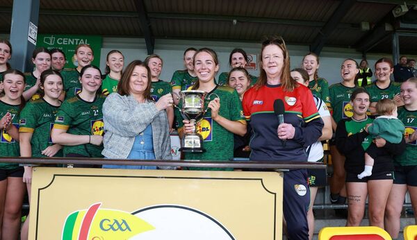 St Andrew's captain Orla Bolger accepts the Tellab IFC trophy from Breda Moore with Bernie Kearns Vice Chairperson of Carlow LGFA. Photo: Pat Ahern