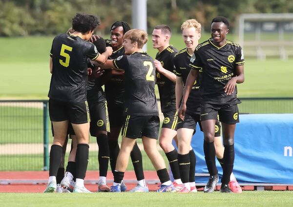 CK United's Timi Adeleye celebrates his late equalising goal against Villa with his teammates.