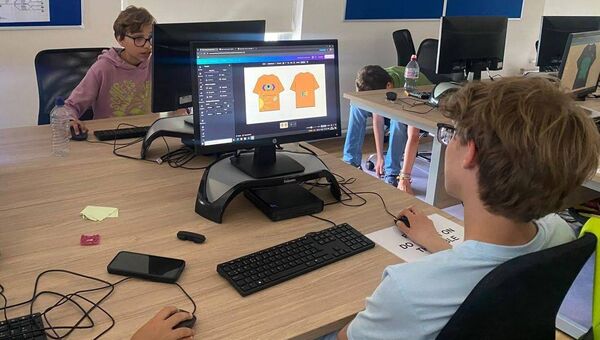 Participants designing t-shirts at a workshop in Carlow College