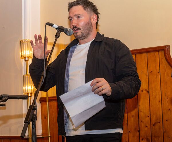 Songwriter Hugsie reads a poem he wrote Songwriter Hugsie reads a poem he wrote