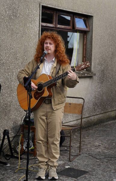 Aaron Smith from Mac Rua performs at the service Aaron Smith from Mac Rua performs at the service