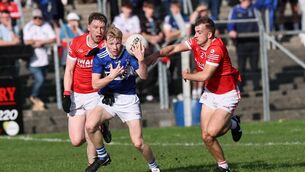 <p>Daniel Brennan from Old Leighlin squeeses through Éire Óg pair, Lee Moore and Shane Buggy </p> <p>Daniel Brennan from Old Leighlin squeeses through Éire Óg pair, Lee Moore and Shane Buggy </p>