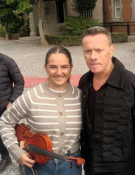 Hillary pictured with founding member of U2, Larry Mullen Jr 