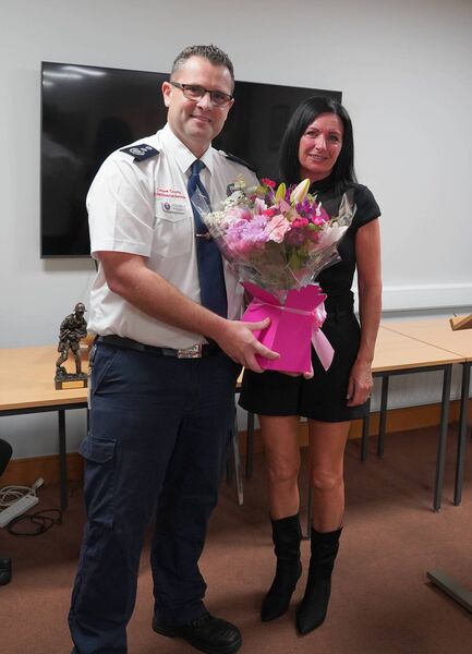 Acting CFO Ben Woodhouse makes a presentation to Lorraine Owens.