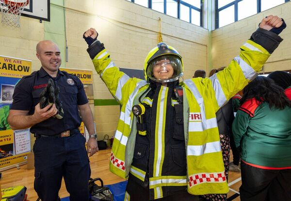 Ketrin Lakatos from St Leo's College tries on a firefighter's uniform for size! Pictured with Ronan Doyle from Carlow County Fire and Rescue Service Ketrin Lakatos from St Leo's College tries on a firefighter's uniform for size! Pictured with Ronan Doyle from Carlow County Fire and Rescue Service