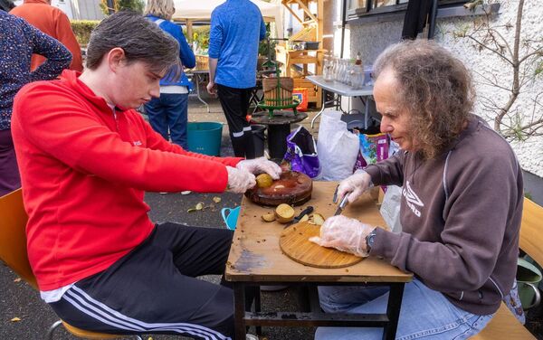 Cian and Kevin prepare the apples for the apple pressing during the harvest festival Cian and Kevin prepare the apples for the apple pressing during the harvest festival