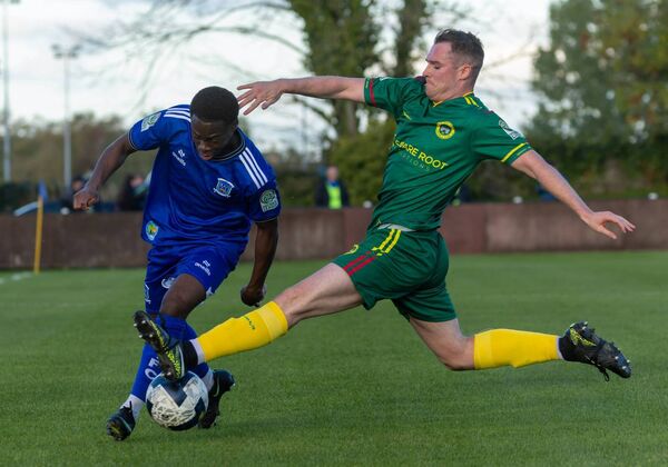 CK United’s Shane Barnes puts in a brilliant challenge on Newbridge Town’s Moses Alabi. Photos: Michael O'Rourke CK United’s Shane Barnes puts in a brilliant challenge on Newbridge Town’s Moses Alabi. Photos: Michael O'Rourke