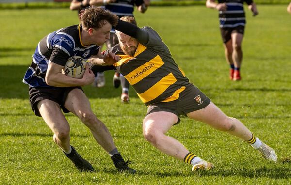 Evan Gordon tackles Wexford’s Bobby Connolly on what was a sensational performance from the Carlow hooker.