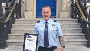<p>Paul Gardiner with his Water Safety Ireland National Lifesaving Bravery Award outside the Mansion House in Dublin last week</p>