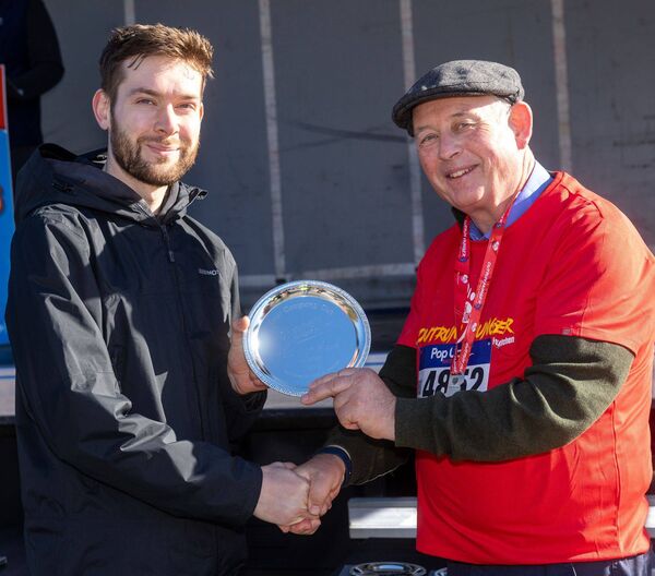 Fr Dunphy with Emmet Darcy with first place overall in the 10k race Fr Dunphy with Emmet Darcy with first place overall in the 10k race