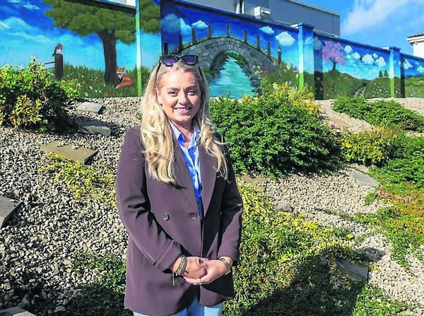 Artist Magdalena Czerska in front of the mural she painted in Fiacc’s House, Graiguecullen Artist Magdalena Czerska in front of the mural she painted in Fiacc’s House, Graiguecullen