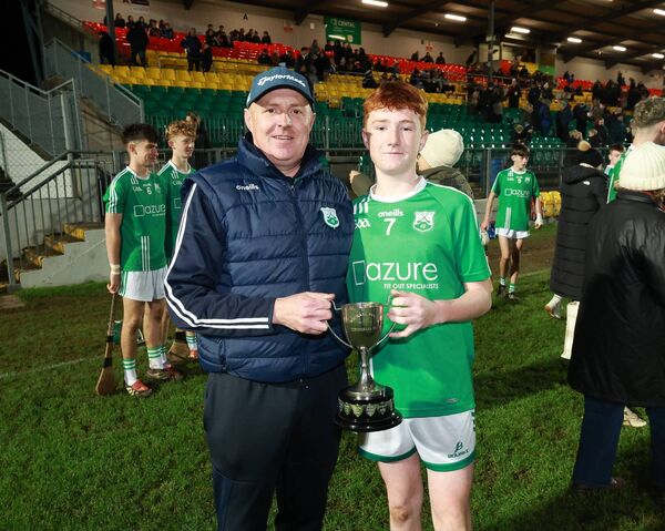 St Mullins joint captain Charlie Foley with his dad Shane, a well known referee around the county