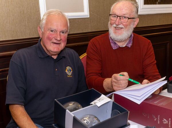 Bob Jeffers and Terry Coffey with some of the lots up for grabs at the auction
